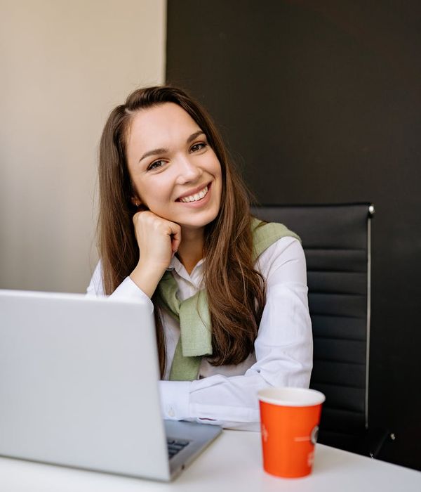 Woman feeling energetic and balanced in a bright room.